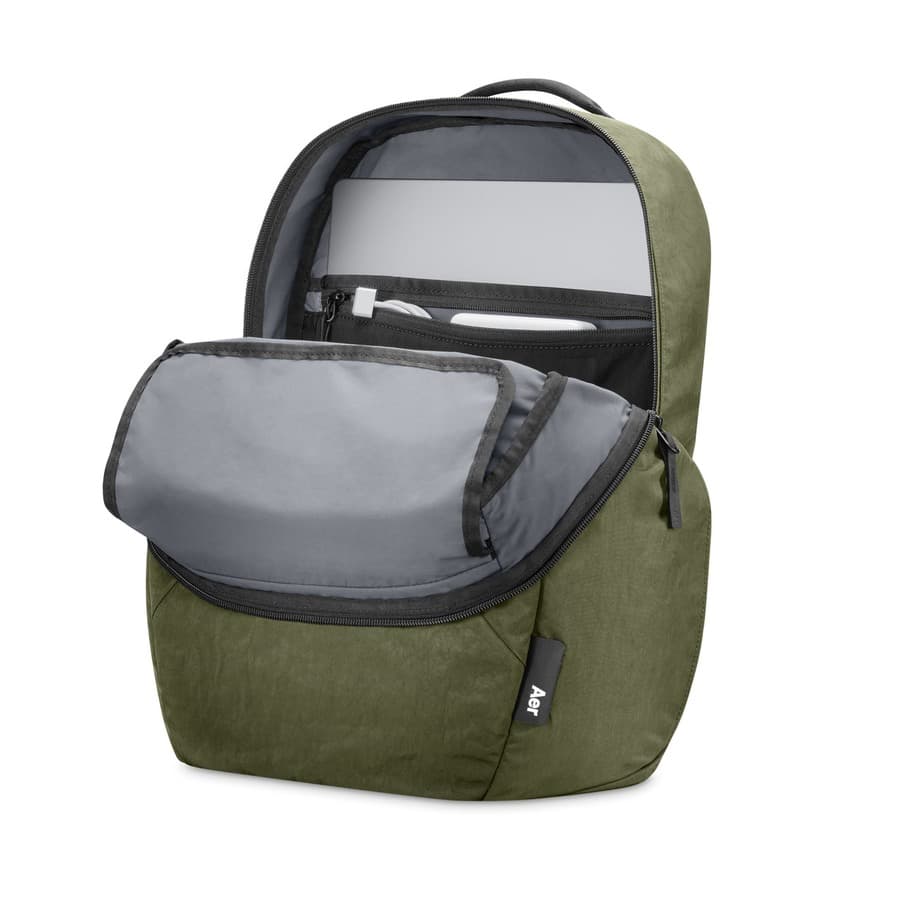 Aer Go Pack 2, front exterior, unzipped open, flap folded down, MacBook stored in rear pocket, USB-C cable coiled into i Apple sale