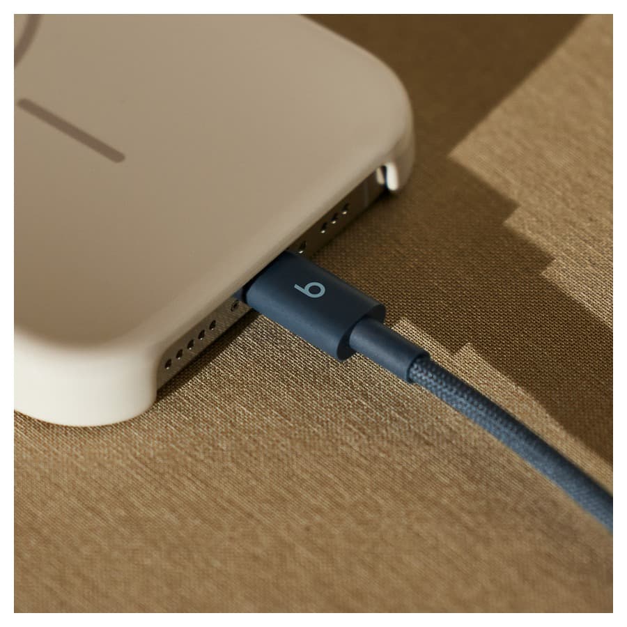 Beats USB-C to USB-C Woven Cable in Nitro Navy connected to an Apple iPhone. Apple sale