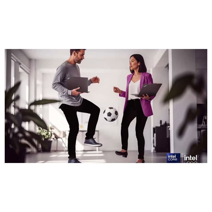 Two colleagues standing in a hallway and kicking a soccer ball back and forth. Lenovo sale