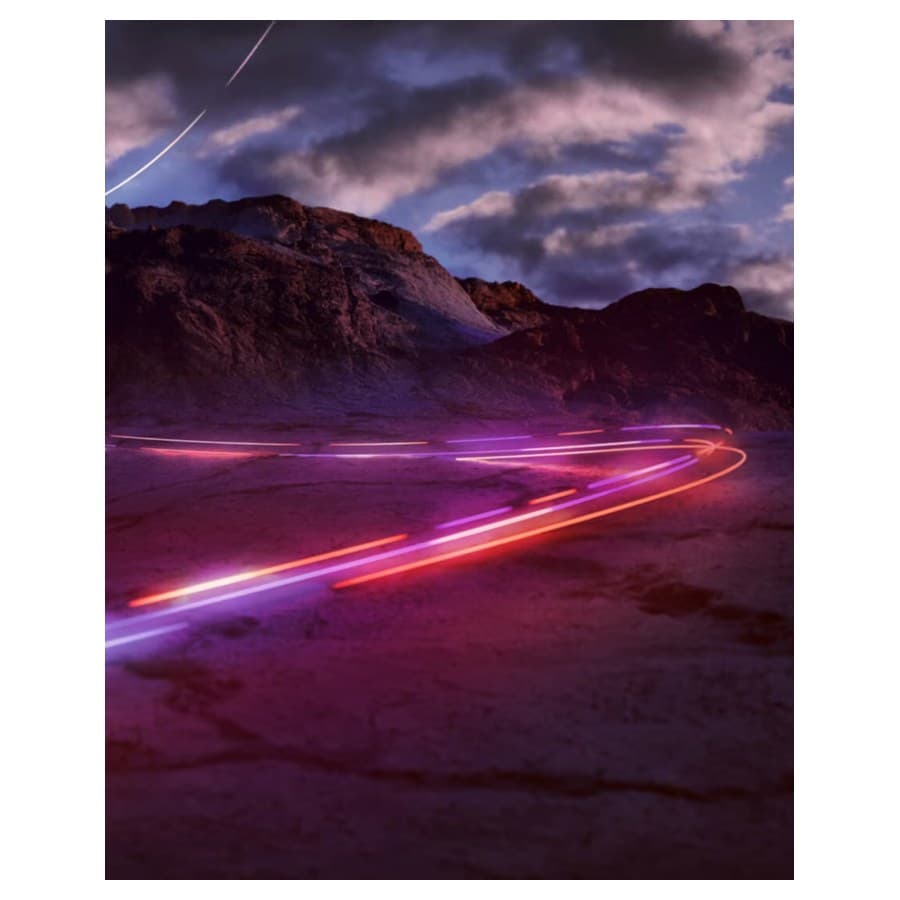 Blurred car lights from car driving fast through a mountain range at night. Lenovo sale