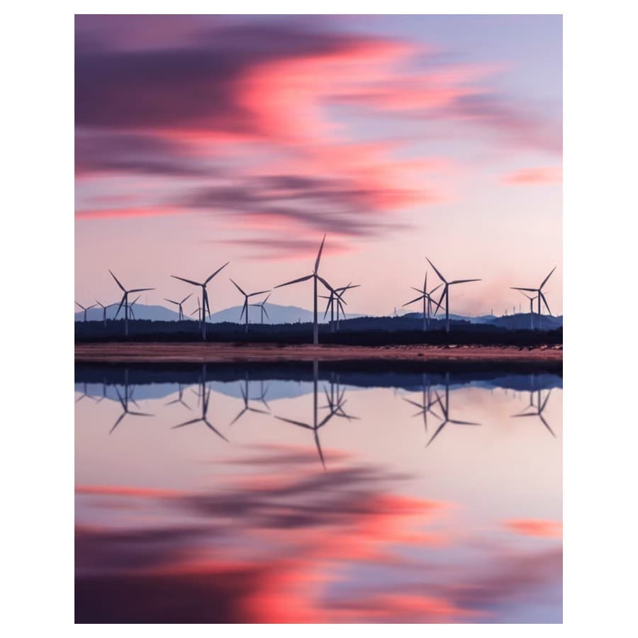 Wind farm in the distance during sunset. Lenovo sale