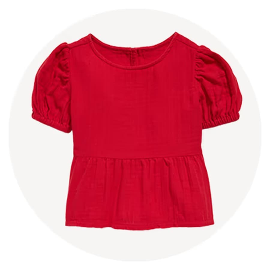 Red short-sleeve blouse with puff sleeves and a peplum hem on a white background. Old Navy sale